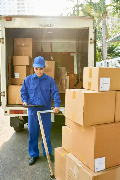 depositphotos_241678680-stock-photo-young-vietnamese-courier-loading-his